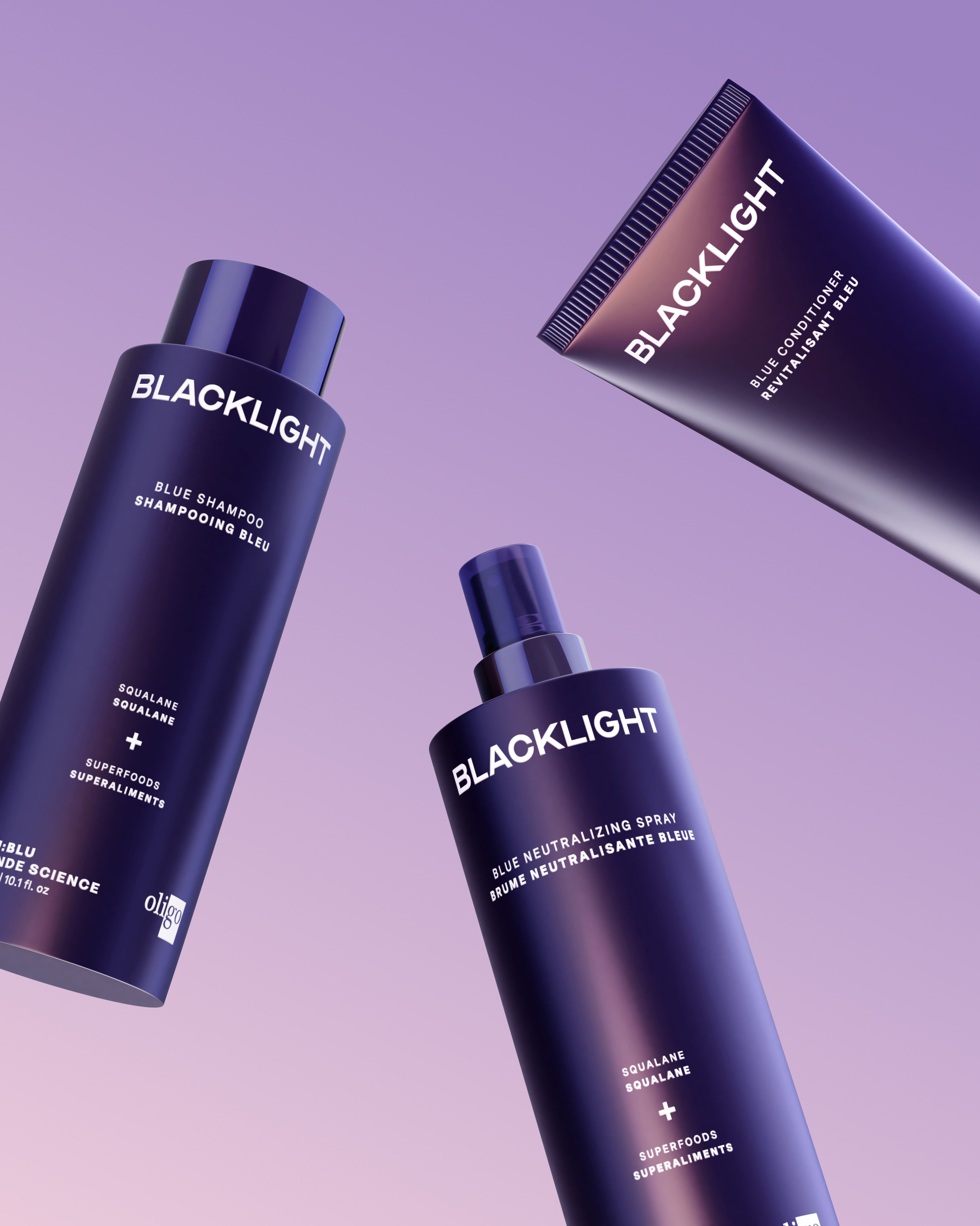 Lineup of Neutralizing Blue Blacklight Blonde Science products including shampoo, conditioner and neutralizing spray